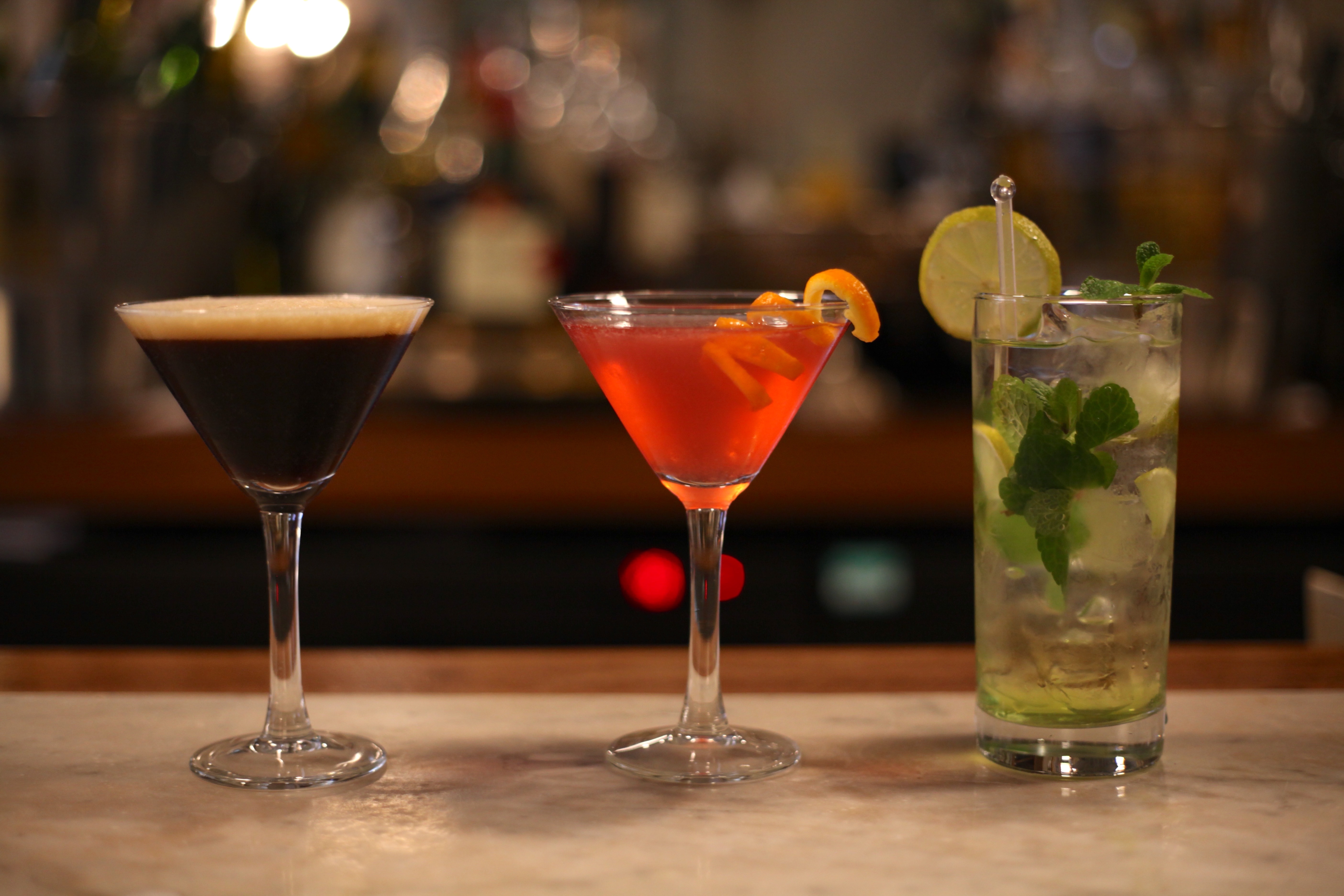 Three cocktails - espresso martini, cosmopolitan and mojito