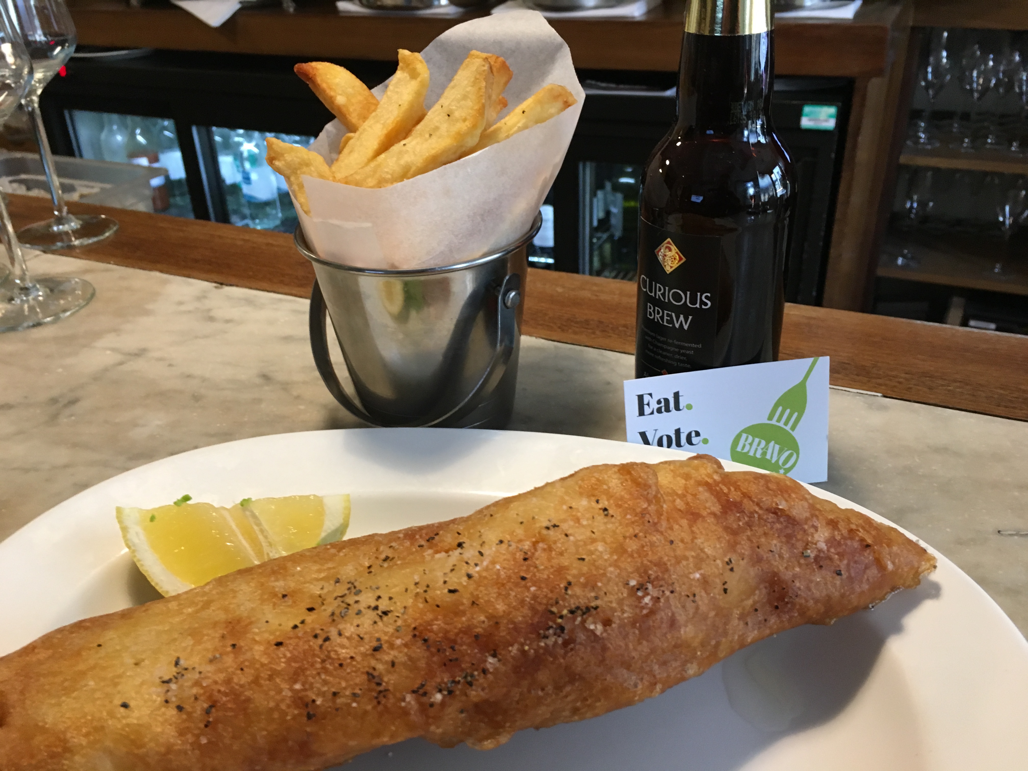 Vote for English's of Brighton in the BRAVO Awards. Plate of fish and chips with BRAVO card